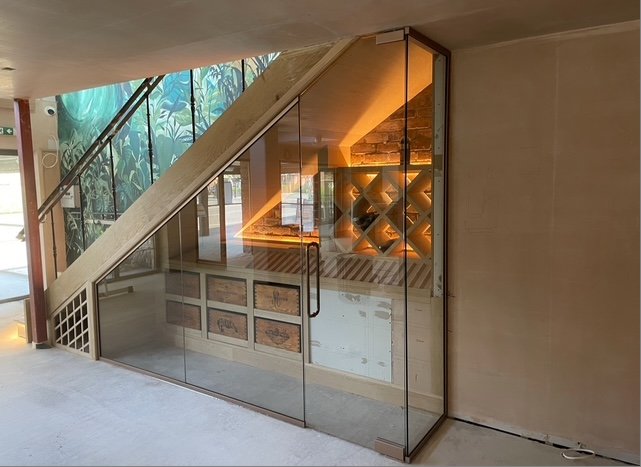 Bespoke glass enclosure under stairs Manchester